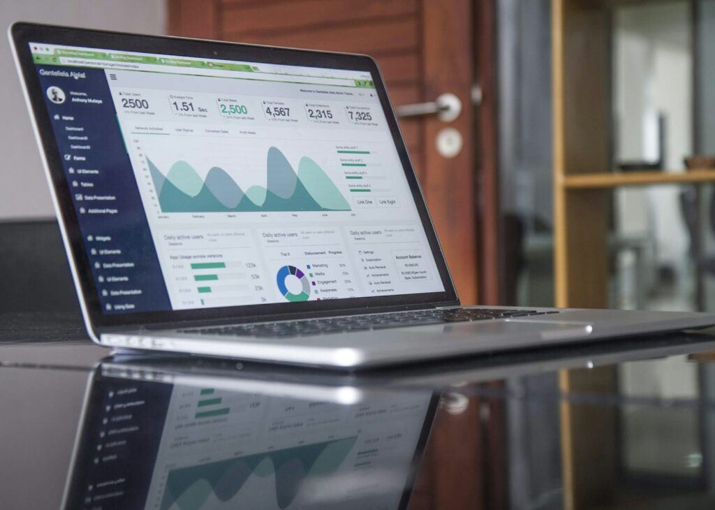 Digital marketing analytics dashboard on a laptop showing 2027 campaign performance trends