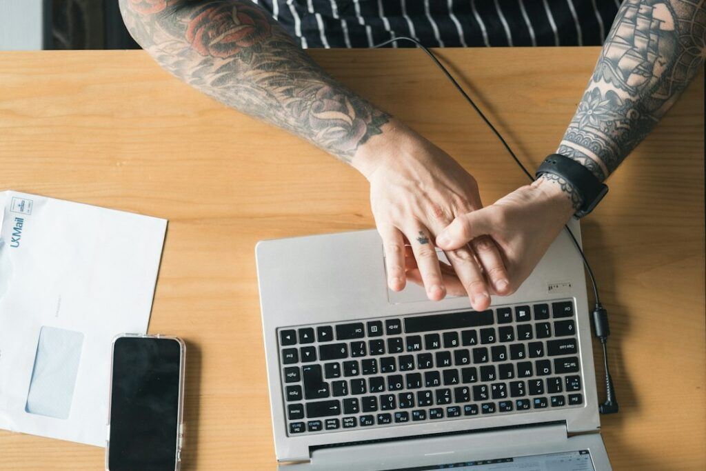Small business owner comparing Facebook ads and Google Ads campaign results on a laptop