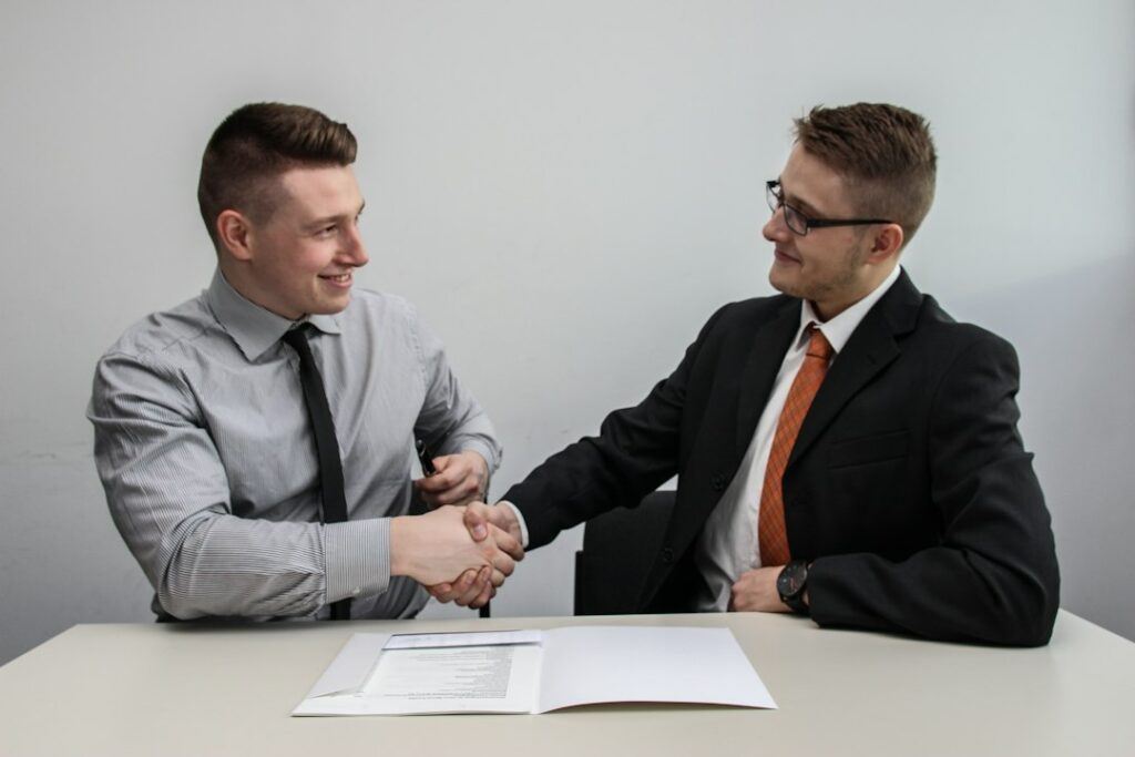 Business owner meeting an SEO agency team to discuss a proposal
