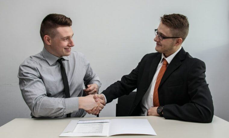 Business owner meeting an SEO agency team to discuss a proposal