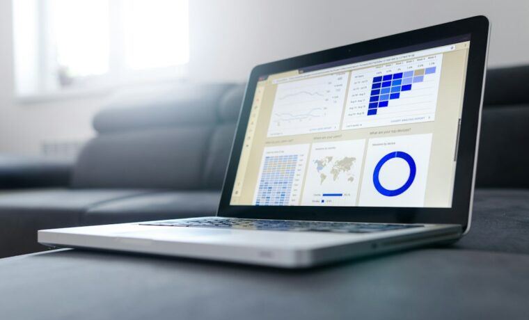 Laptop screen showing a website performance report with loading speed metrics