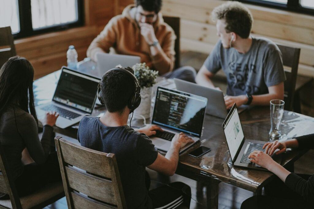 Agency team reviewing client SEO work together on laptops