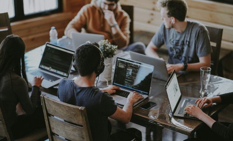 Agency team reviewing client SEO work together on laptops